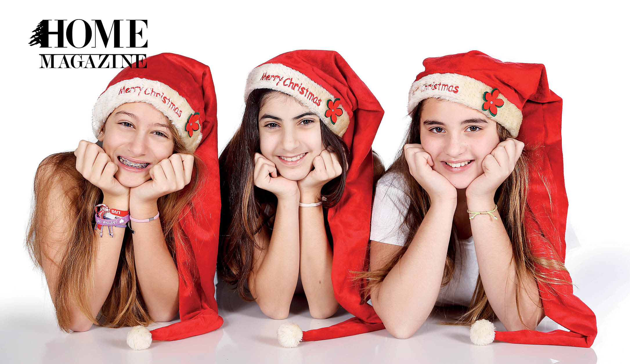 Teenage girls wearing Christmas hats