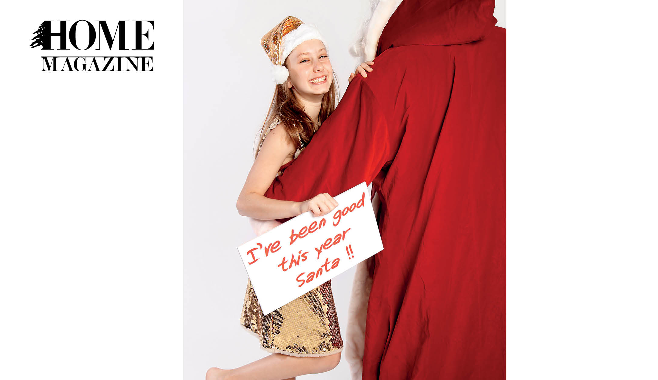 Teenage girl with Christmas hat, Santa Claus and a sign