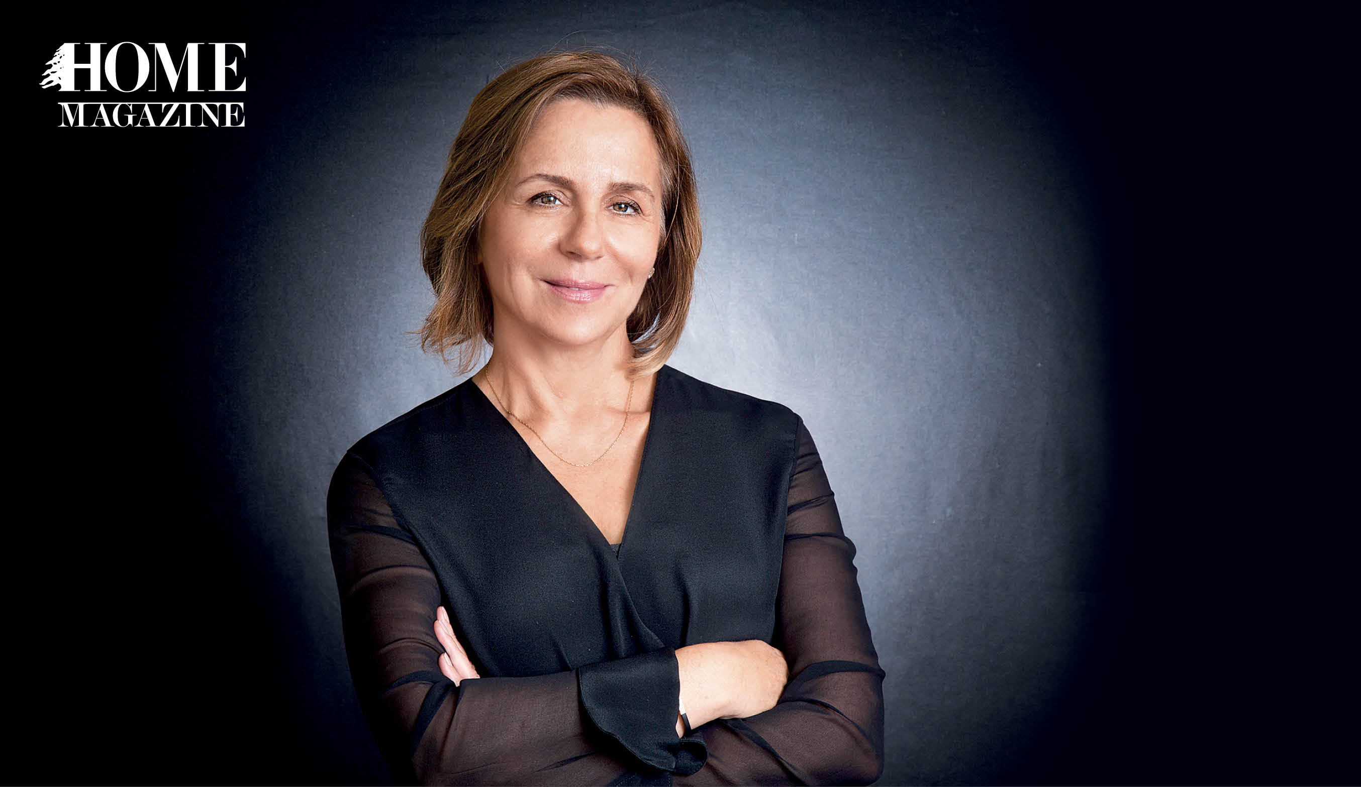 Women smiling in black background and black top