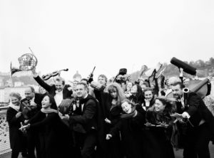 people all holding different instruments