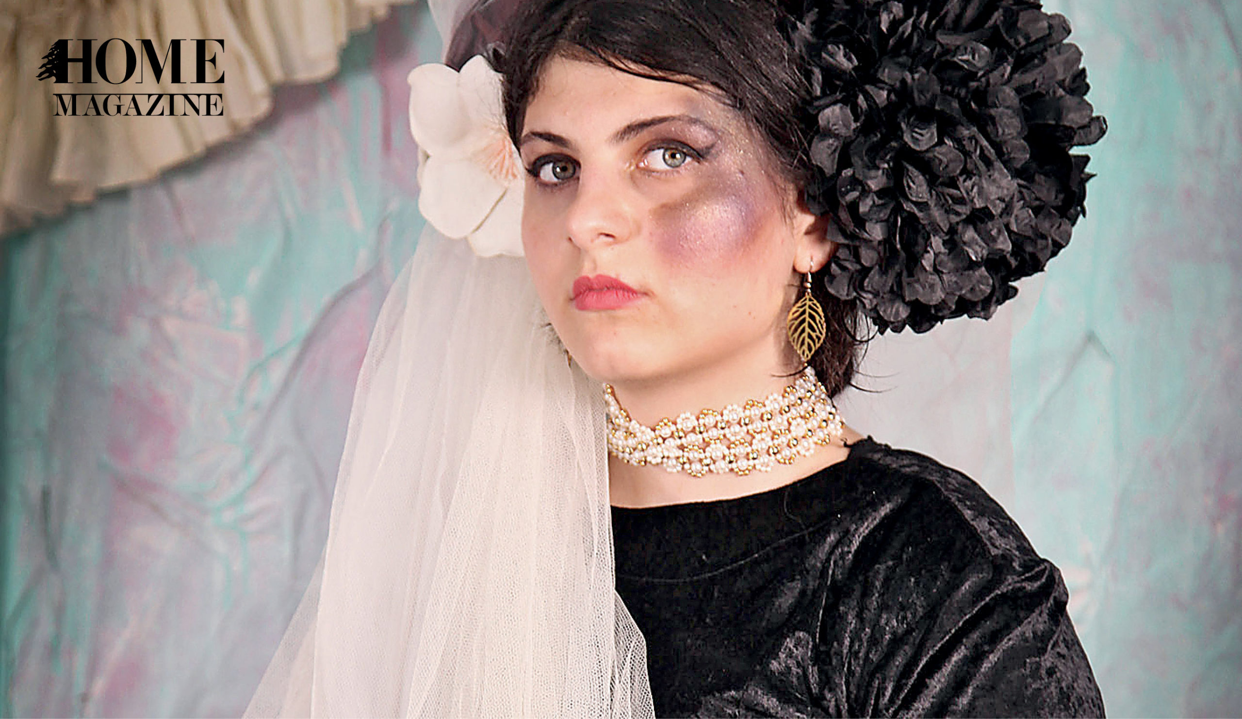 Face portrait of a woman with makeup, necklace, a flower and a hat