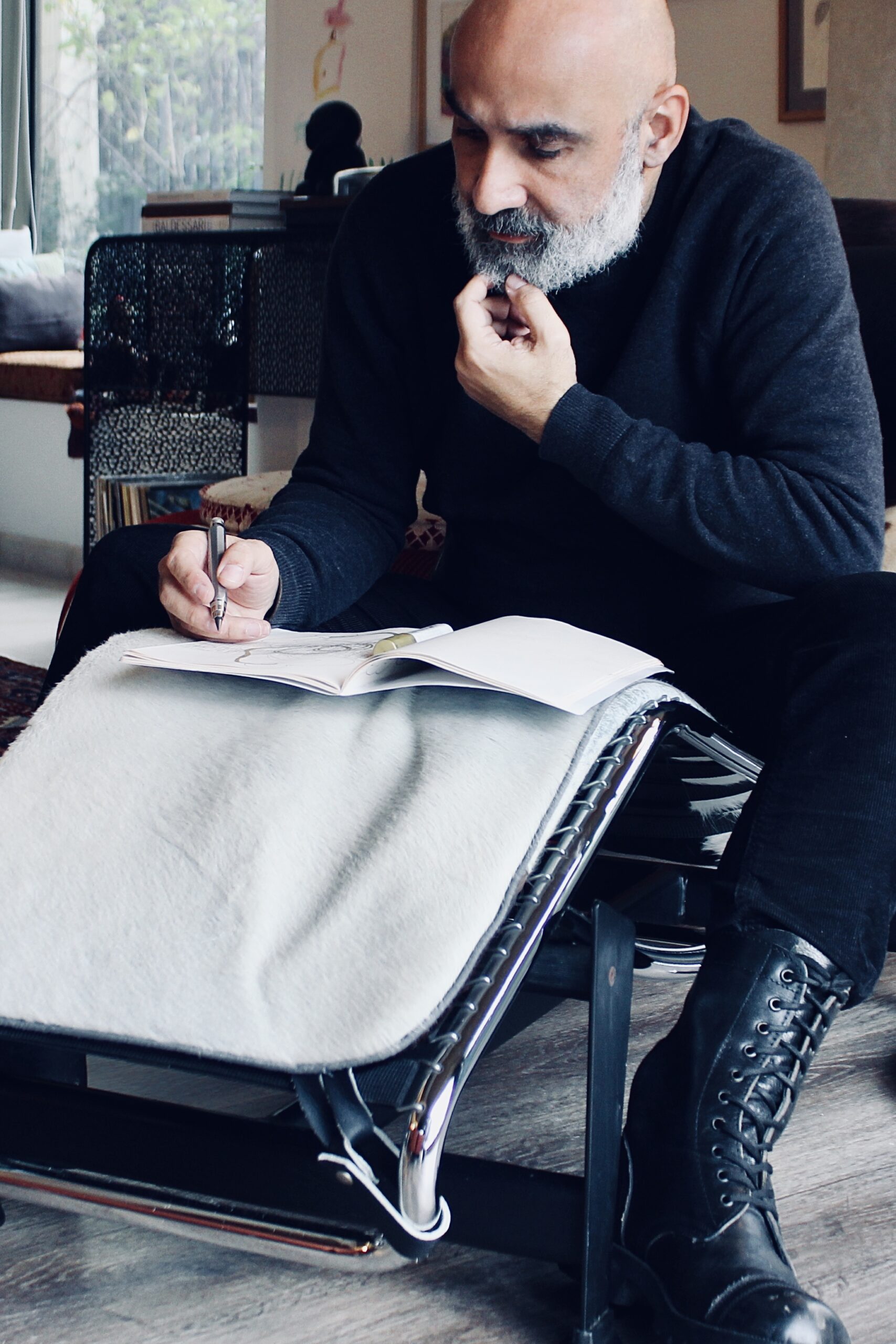 the artist wissam melhem sitting drawing 